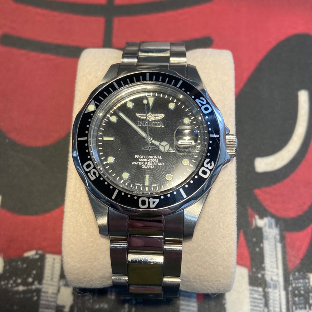 Invicta Watch. 8.6/10 condition. (needs a new battery, but not worth my time.)